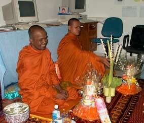 Monks receiving gifts at the ceremony